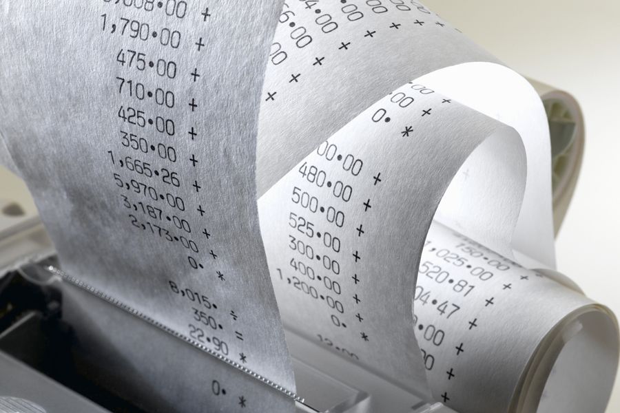 A close up of receipts being printed out.